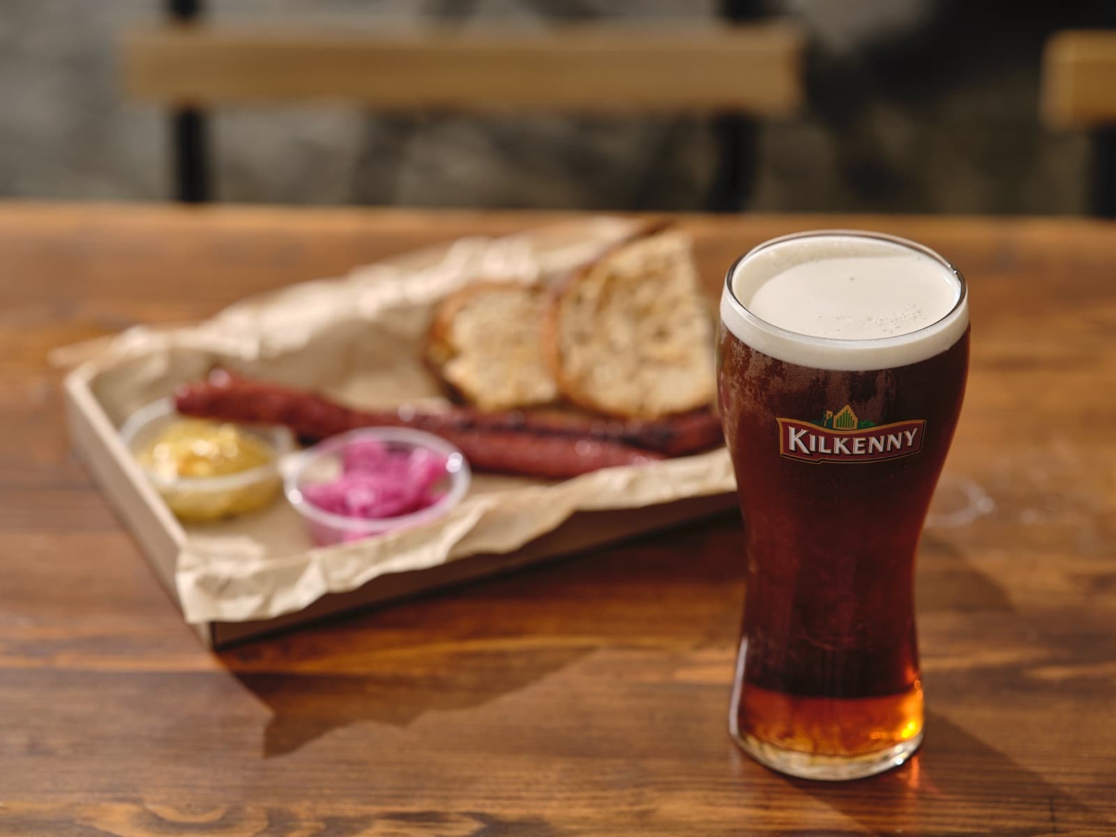 Sausage platter with a glass of red ale